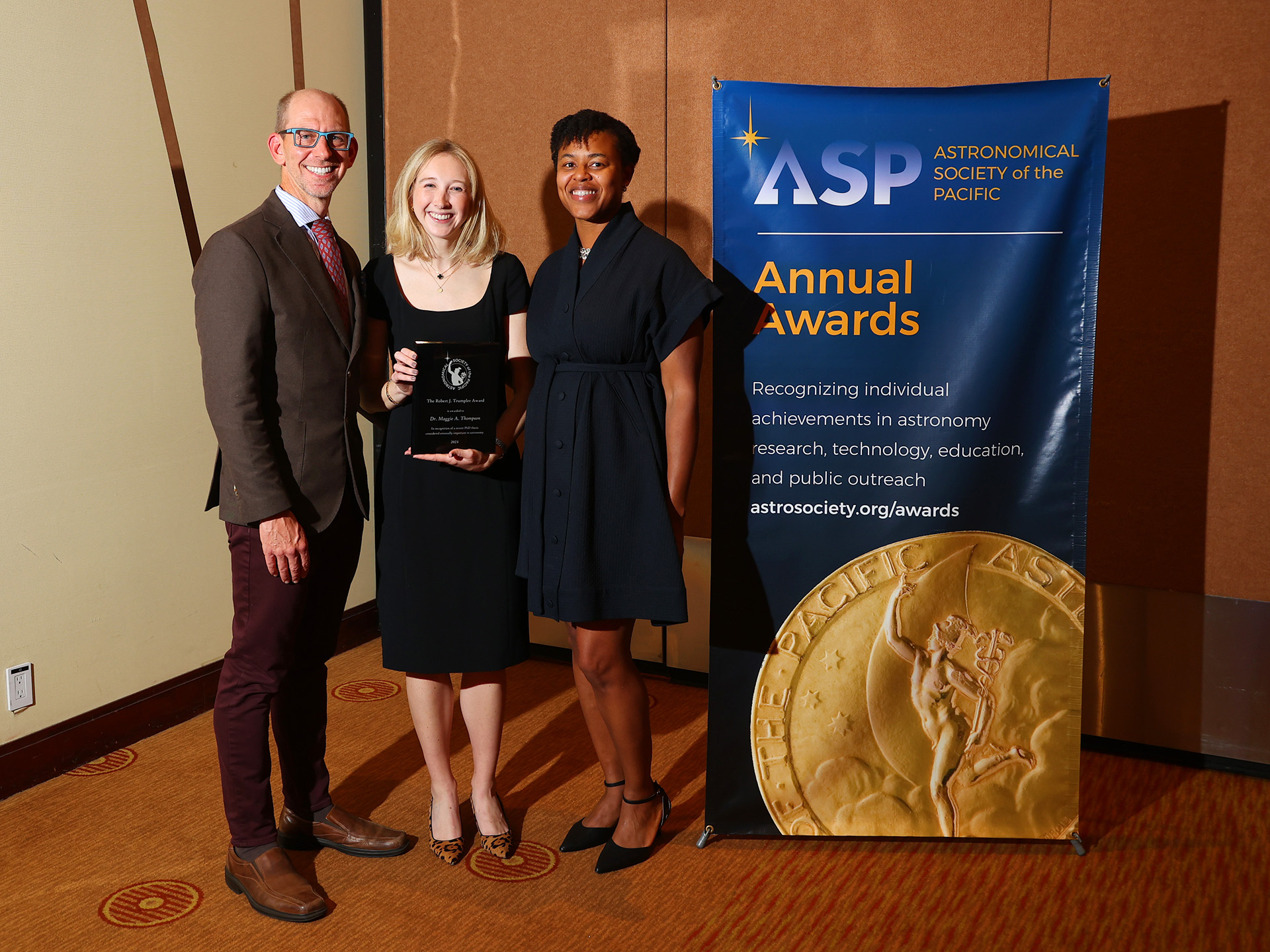 Enlarged view: Dr. Maggie Thompson with her award